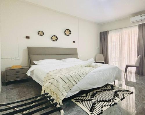 En eller flere senge i et værelse på Santosha Beach Escape