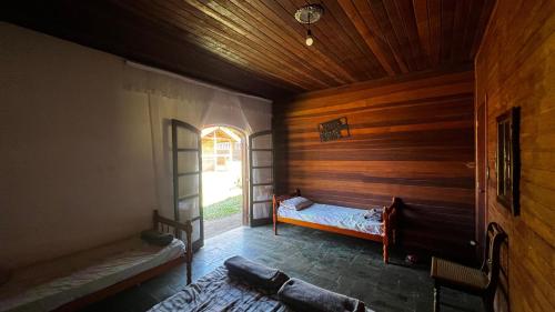 Postel nebo postele na pokoji v ubytování Sítio pousada recanto curió