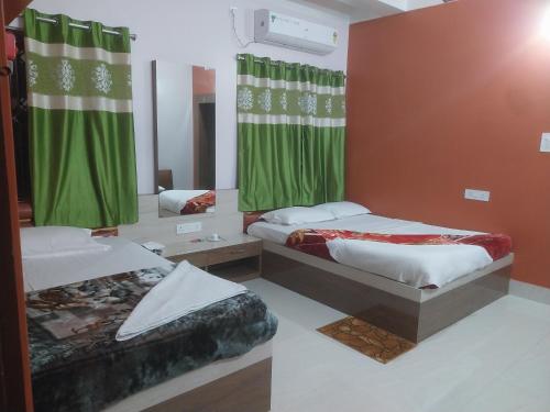 Postel nebo postele na pokoji v ubytování Prime Inn Guest House