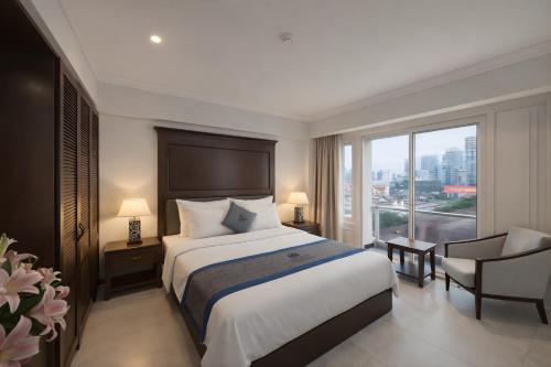 En eller flere senge i et værelse på Anphan Hotel & Spa - Ben Thanh Market