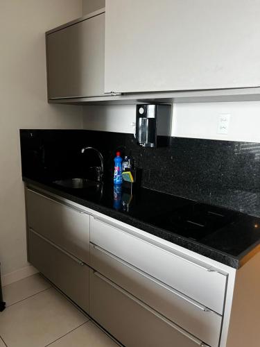 Køkken eller tekøkken på Luxuoso Flat particular ATHOS BULCÃO