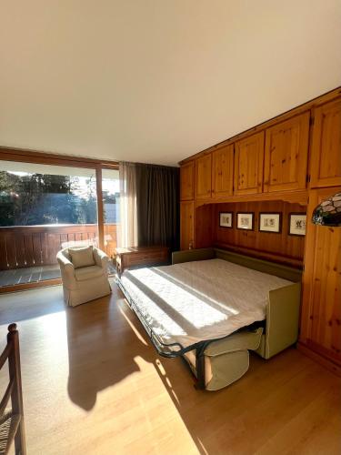 Ένα ή περισσότερα κρεβάτια σε δωμάτιο στο Monolocale Collini