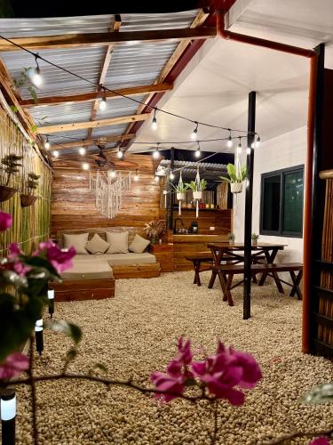 a living room with a couch and a table at Gym house in San Vicente