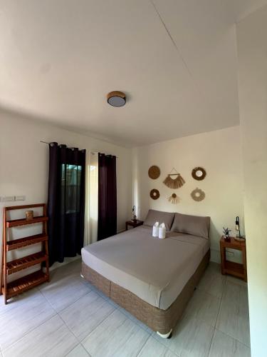 a bedroom with a large bed in a room at Gym house in San Vicente