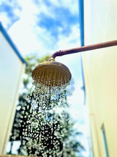 a brush hanging from the side of a building at Waves for Daze in Middleton