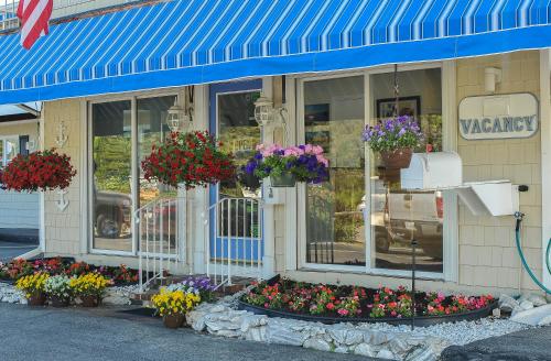 a store with flowers on the front of it at Friendship Oceanfront Suites in Old Orchard Beach