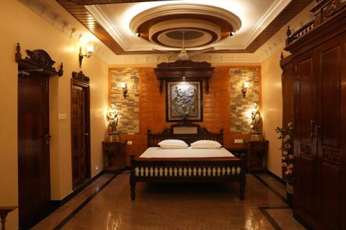 a bedroom with a large bed in a room at SK Grand Palace in Pondicherry