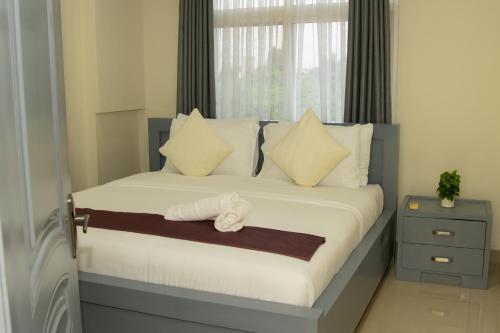 En eller flere senge i et værelse på The Reach Apartments