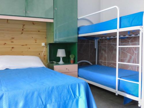 Ένα ή περισσότερα κρεβάτια σε δωμάτιο στο Villaggio Camping Rancho