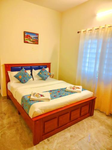 a bedroom with a bed with two towels on it at Hotel Propel Inn in Dobbspet