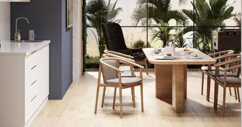 a dining room with a table and chairs and a kitchen at Luxury Studio in Dubai in Dubai