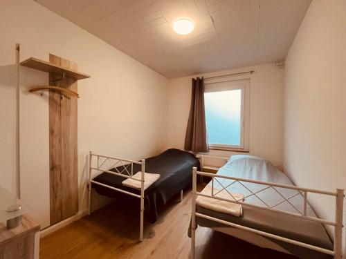 Giường trong phòng chung tại GR Appartements