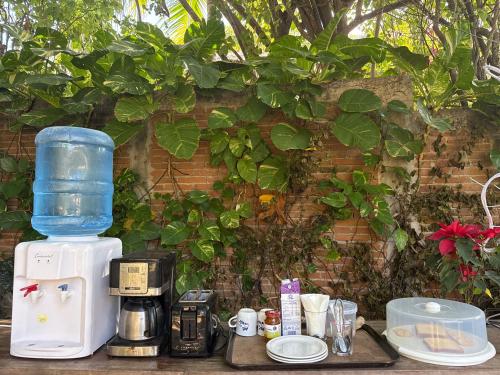 a coffee maker sitting on top of a table at Casa Siddhartha in Mazunte