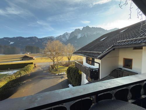 a view from the balcony of a house with mountains in the background at Gästehaus Florian in Grainau