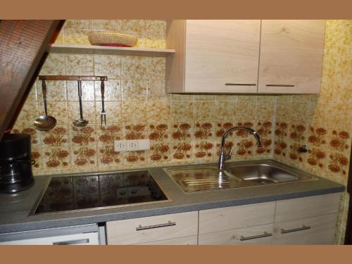 a kitchen with a sink and a counter top at Charmantes Ferienhaus in Skigebietsnaehe in Schmallenberg