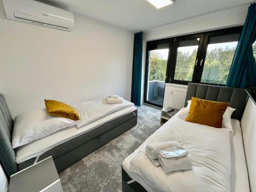 Giường trong phòng chung tại Apartament LuMi