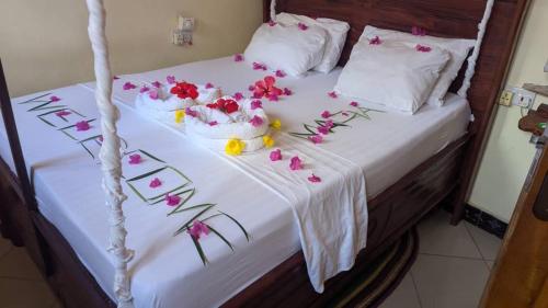 En eller flere senge i et værelse på Kua Garden Bungalow