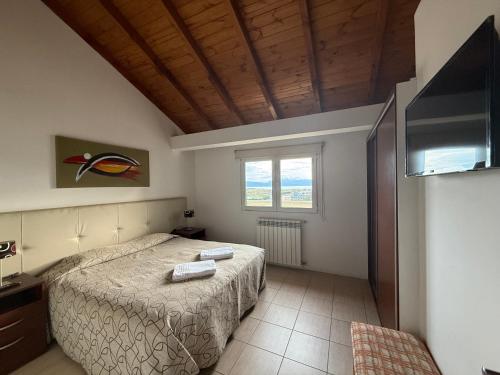 En eller flere senge i et værelse på Los Arboles Apart