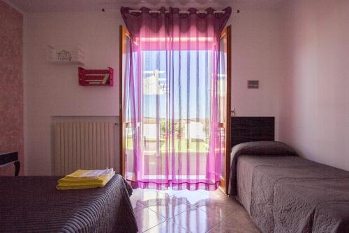 Cama o camas de una habitación en Le Cromie Catignano