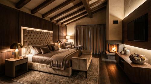 une chambre avec un grand lit et une cheminée dans l'établissement Elegance Home, à Cortina dʼAmpezzo