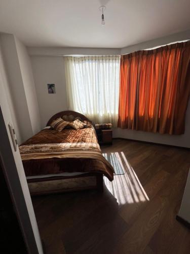 En eller flere senge i et værelse på Departamento Respiro de Altura