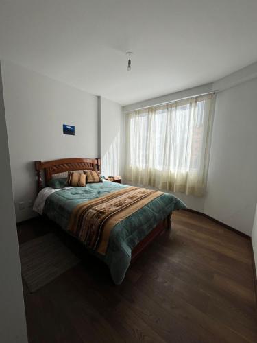 En eller flere senge i et værelse på Departamento Respiro de Altura