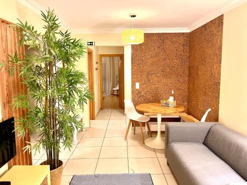 a living room with a couch and a table at Casas do Mar - Baleal 1 - Sea House in Baleal