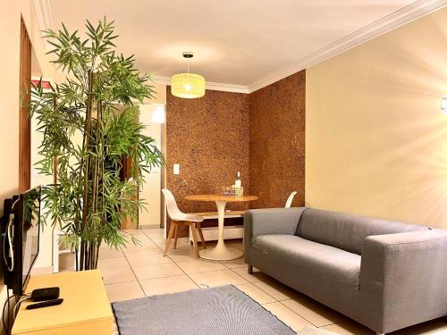 a living room with a couch and a table at Casas do Mar - Baleal 1 - Sea House in Baleal
