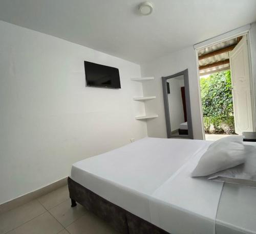 Ένα ή περισσότερα κρεβάτια σε δωμάτιο στο Hotel Mirador Quindío Eje Cafetero