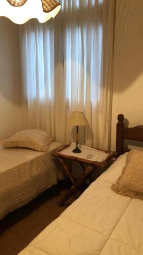 En eller flere senge i et værelse på RivadaviaApart