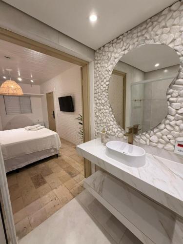 Et badeværelse på Kanga Suítes - Aquário