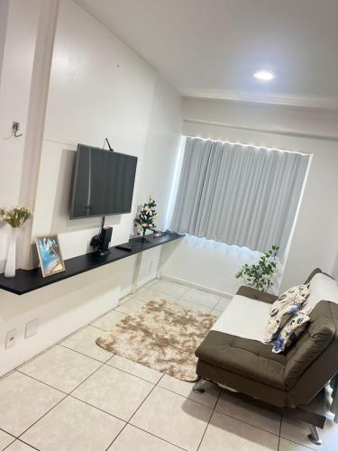 Et tv og/eller underholdning på Apartamento em Maceió a beira mar