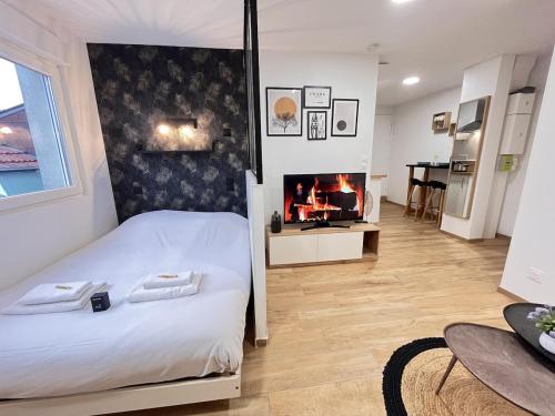 En eller flere senge i et værelse på Paris 24 - Studio calme, cosy proche centre Reims