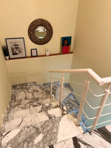 a room with a marble staircase with a mirror at Pansion Most , Mostar in Mostar