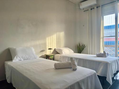 En eller flere senge i et værelse på Casa Jutaí - your home in Belém