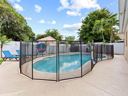 a swimming pool with a fence around it at Tropical Bay House-Near By Brickell, Wynwood and South Beach in Miami