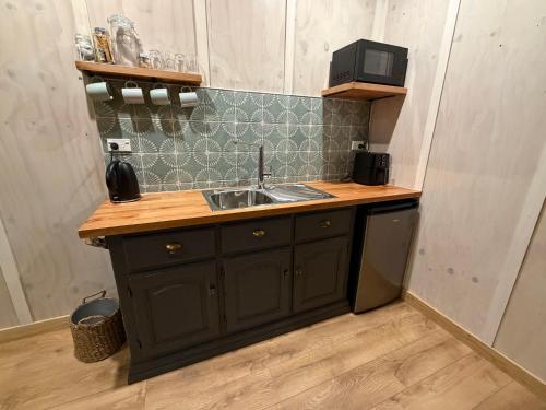 a kitchen with a sink and a counter top at Kotare View- Studio accommodation, Tataraimaka in Tataraimaka