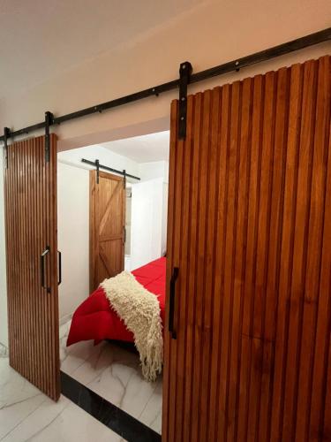 En eller flere senge i et værelse på Departamento Vicco