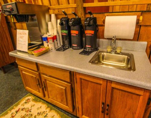 a kitchen counter with a sink next to a sink at Smoketree Lodge in Banner Elk