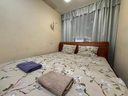 Postel nebo postele na pokoji v ubytování Воскресенская 12- 2 кв Евро Центр