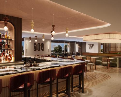 eine Bar in einem Restaurant mit Stühlen und Tischen in der Unterkunft Hotel Solaya in Scottsdale