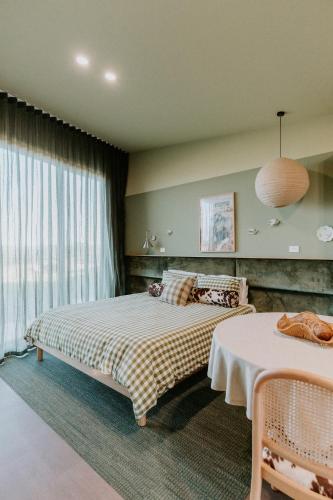a bedroom with a bed and a large window at Hahndorf Farm Barn in Hahndorf