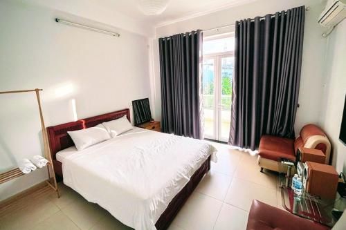 En eller flere senge i et værelse på Phòng ngủ giường đôi ban công Sol homesay