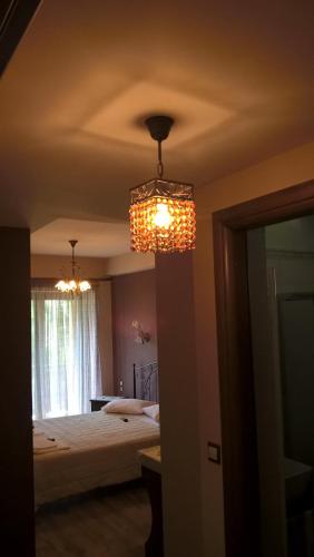 Ένα ή περισσότερα κρεβάτια σε δωμάτιο στο Guesthouse Kastania Korakis