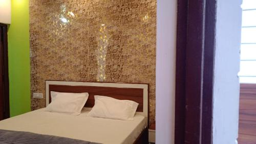 Postel nebo postele na pokoji v ubytování Tree Heaven Homestay