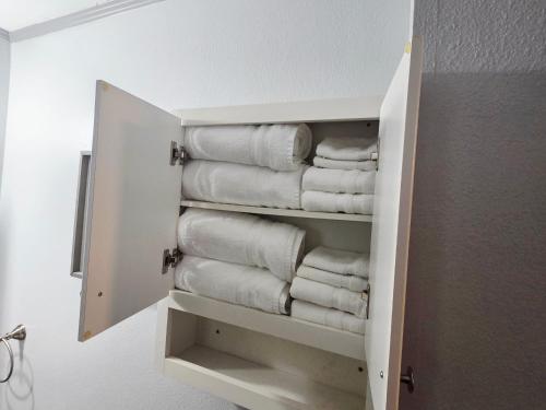 a towel rack with towels in a bathroom at RED DOOR HOUSE in Lakeland