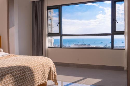 En eller flere senge i et værelse på A Letter from the Sea Breeze