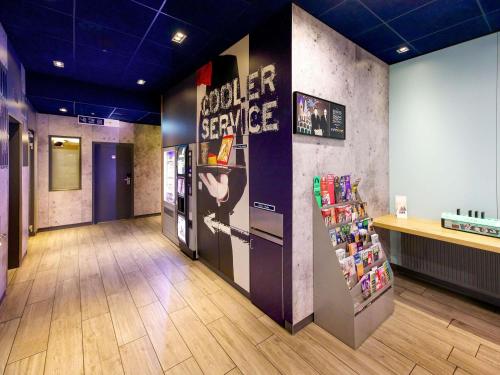 a room with a soda machine in a store at Ibis budget Berlin Potsdamer Platz in Berlin