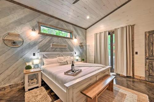 a bedroom with a large bed and a window at Moonlight Trail in Broken Bow
