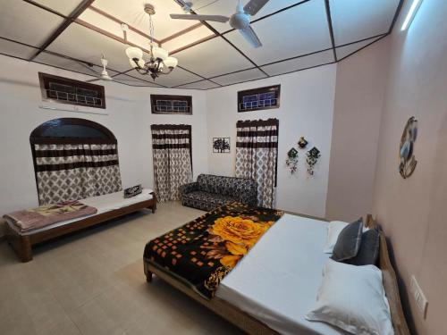 En eller flere senge i et værelse på Green Reed Resort By Meenakshi, Kaziranga